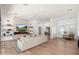 Spacious living room with a fireplace, hardwood floors, and ample natural light throughout at 7710 E Tardes Dr, Scottsdale, AZ 85255