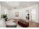 Open-concept living area featuring hardwood floors, recessed lighting, and comfortable sectional sofa at 7710 E Tardes Dr, Scottsdale, AZ 85255