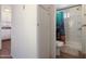 A view from the hall leading to a bathroom with a stand up shower and sea life curtain at 7807 E Main St # E2, Mesa, AZ 85207