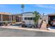 Charming manufactured home with mature desert landscaping and a covered carport at 7807 E Main St # E2, Mesa, AZ 85207