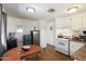 Compact kitchen with linoleum floors, white cabinets, and eat-in dining area at 7807 E Main St # E2, Mesa, AZ 85207