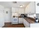 This kitchen features classic white cabinetry and a dual stainless steel sink at 7807 E Main St # E2, Mesa, AZ 85207