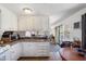 Bright kitchen with white cabinetry, updated appliances, and ample sunlight at 7807 E Main St # E2, Mesa, AZ 85207