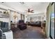 Comfortable living room with ceiling fan, natural light, and neutral decor at 7807 E Main St # E2, Mesa, AZ 85207