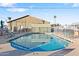 The property boasts a community pool with a shallow end and fenced for safety at 7807 E Main St # E2, Mesa, AZ 85207
