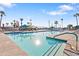 The community pool features lush palm trees, lounging area and is well-maintained at 7807 E Main St # E2, Mesa, AZ 85207