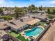 Enjoy a beautiful aerial view of this home with a backyard oasis featuring a pool, spa, and spacious patio at 818 N Terrace St, Mesa, AZ 85203
