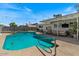 Inviting backyard with a sparkling pool, patio, and outdoor seating areas at 818 N Terrace St, Mesa, AZ 85203
