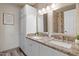 Bathroom features double sinks with granite countertops, and a walk-in shower at 818 N Terrace St, Mesa, AZ 85203