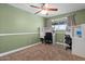 Comfortable bedroom featuring a ceiling fan, carpeted floors, and built in desk with ample shelving at 818 N Terrace St, Mesa, AZ 85203
