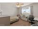 Bright bedroom with natural light, a desk, and a bookshelf at 818 N Terrace St, Mesa, AZ 85203