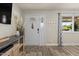 Inviting entryway with decorative door and wood-look floors, offering a warm welcome at 818 N Terrace St, Mesa, AZ 85203