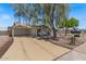 Well-maintained home featuring desert landscaping, a shade tree, and a charming front entrance at 818 N Terrace St, Mesa, AZ 85203