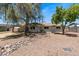 Charming home with desert landscaping, a large shade tree, and great curb appeal at 818 N Terrace St, Mesa, AZ 85203