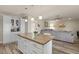 Open-concept kitchen with granite countertops, island seating, and access to the living area at 818 N Terrace St, Mesa, AZ 85203