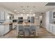 Bright kitchen featuring granite countertops, stainless steel appliances, and a breakfast bar seating at 818 N Terrace St, Mesa, AZ 85203