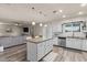 Modern kitchen with granite countertops, an island, stainless steel appliances, and ample storage at 818 N Terrace St, Mesa, AZ 85203