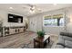 Cozy living room featuring modern decor, a large window, and hardwood floors at 818 N Terrace St, Mesa, AZ 85203