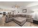 Open floor plan featuring a large sectional couch and view into the kitchen at 818 N Terrace St, Mesa, AZ 85203
