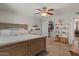 Spacious main bedroom with neutral tones, a ceiling fan, and closet access at 818 N Terrace St, Mesa, AZ 85203