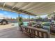 Outdoor patio with comfortable seating overlooking the pool and landscaping at 818 N Terrace St, Mesa, AZ 85203