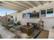 Relaxing outdoor patio area with comfortable seating and outdoor television at 818 N Terrace St, Mesa, AZ 85203