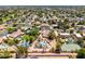 Neighborhood aerial view showcasing the home's prime location and neighboring properties with pools and tennis courts at 8606 S Dorsey Ln, Tempe, AZ 85284