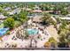 Overhead view of a pool, tennis court, covered outdoor kitchen area, and lush landscaping at 8606 S Dorsey Ln, Tempe, AZ 85284
