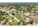 Aerial view of an extensive property featuring a pool, tennis courts, horse facilities and a home at 8606 S Dorsey Ln, Tempe, AZ 85284