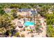 Property featuring lush landscaping, a private pool and a new structure being built adjacent to the lot at 8606 S Dorsey Ln, Tempe, AZ 85284