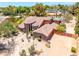 Aerial view of custom home on a large lot featuring desert landscaping, pool and tennis court at 8606 S Dorsey Ln, Tempe, AZ 85284
