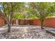Backyard featuring mature trees, a storage shed, and gravel at 8606 S Dorsey Ln, Tempe, AZ 85284