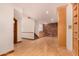 The basement features a wet bar with wood cabinets, a brick accent wall, and a carpeted stairwell at 8606 S Dorsey Ln, Tempe, AZ 85284