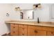 Bathroom with a vanity with cabinets and drawers, a light-up mirror, and stylish lighting at 8606 S Dorsey Ln, Tempe, AZ 85284