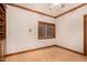 Bedroom with light wood floor and trim, neutral walls, and window with a view at 8606 S Dorsey Ln, Tempe, AZ 85284