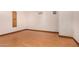 An empty bedroom with laminate flooring and neutral colored walls awaits your design touch at 8606 S Dorsey Ln, Tempe, AZ 85284