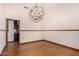 Dining room with hardwood floors and modern chandelier fixture at 8606 S Dorsey Ln, Tempe, AZ 85284