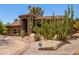 Beautiful custom home featuring desert landscaping, mature cacti, and an ADT security system sign at 8606 S Dorsey Ln, Tempe, AZ 85284