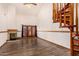 Open living space showcasing a fireplace and spiral staircase, blending warmth with unique architectural design at 8606 S Dorsey Ln, Tempe, AZ 85284
