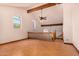 Upstairs living area featuring wood beam ceilings, window seating, and a ceiling fan with lighting at 8606 S Dorsey Ln, Tempe, AZ 85284