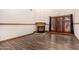 Bright living room featuring a fireplace, wood-look flooring and sliding glass doors leading to a patio at 8606 S Dorsey Ln, Tempe, AZ 85284