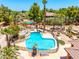 Private backyard features a desert landscaped pool, a built in barbeque and mature palm trees at 8606 S Dorsey Ln, Tempe, AZ 85284