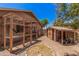 Backyard featuring a custom chicken coop, storage shed, and well-maintained landscaping at 8803 N 105Th Dr, Peoria, AZ 85345