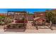 Unique backyard showcasing a potting bench, gardening beds, a charming playhouse and ample gardening space at 8803 N 105Th Dr, Peoria, AZ 85345