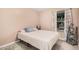 Cozy bedroom with a comfortable bed, soft carpet, and bright natural light from the window at 8803 N 105Th Dr, Peoria, AZ 85345