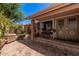 Welcoming front porch with brick accents, a cozy bench, and a charming entrance, creating a warm first impression at 8803 N 105Th Dr, Peoria, AZ 85345