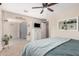 Relaxing main bedroom featuring a plush bed, soft carpet, and access to a bonus space at 8803 N 105Th Dr, Peoria, AZ 85345