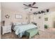 Comfortable main bedroom with ceiling fan, ample closet space, and a calm, inviting atmosphere at 8803 N 105Th Dr, Peoria, AZ 85345