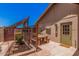 Cozy patio with an outdoor table, seating, gardening beds and covered pergola space for outdoor dining at 8803 N 105Th Dr, Peoria, AZ 85345