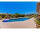 Stunning backyard pool surrounded by lush landscaping, offering a private oasis for relaxation and recreation at 8803 N 105Th Dr, Peoria, AZ 85345